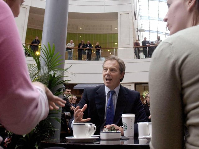 Prime Minister Tony Blair chats with shoppers including Jess Haig, left, a Leeds University student at a cafe in The Light shopping centre. Mr Blair described his encounter with Miss Haig as "a useful exchange".