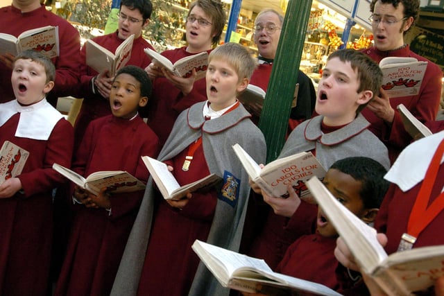 The Leeds Parish Church choir sang Christmas carols for shoppers at Kirkgate Market in December 2005.