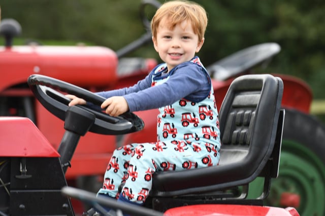 Fergus Eastham (aged 2) enjoying sitting on a tractor