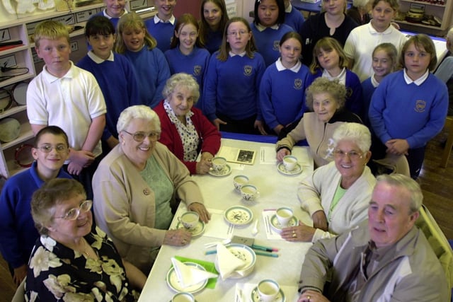 Pensioners were treated to tea to mark the Queen's Golden Jubilee in May 2002 organised by Morley Community Church and served by young pupils at Cross Hall Infants School.