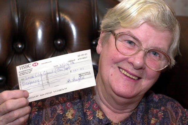Morley resident Helen Hughes with cheque for 1p, the amount she owed for her Council Tax.