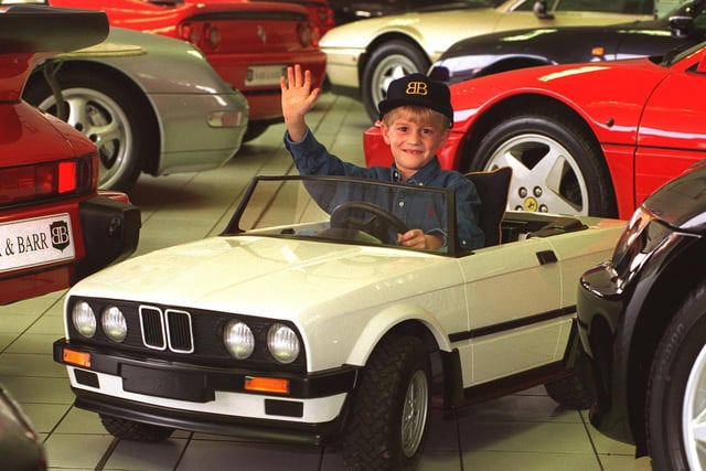 This child-sized BMW convertible with 25cc petrol engine and three speed box was up for sale Barr and Barr's car showroom on Scott Hall Road priced at £1,500. Young Justin Green, pictured, had already made his mind up to put one on his Christmas list.