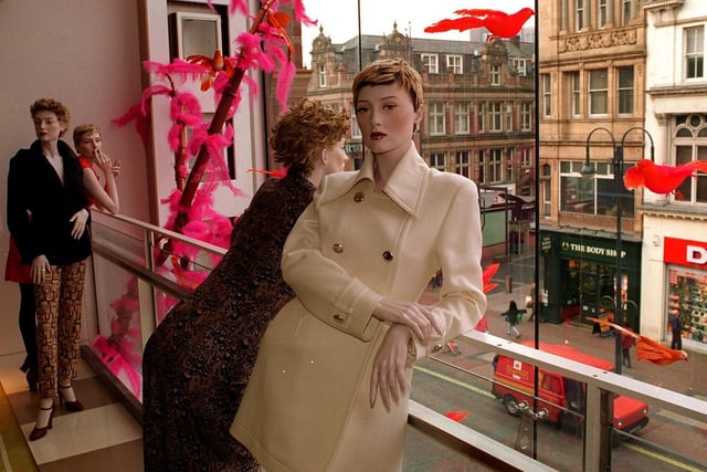 Manequins look down on Briggate from the new Harvey Nichols store.