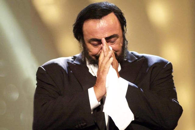 Luciano Pavarotti performing in a home town gig in an amphitheatre in Modena, Italy, which Dave describes as one of the best ever gigs he has covered.