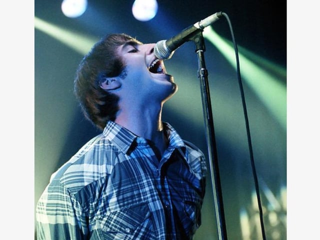 Oasis at a sold-out Empress Ballroom, Blackpool, on October 2 1995. One of the band's seminal gigs which helped propel them into superstars and a photo which captured Liam Gallagher's unique way with a mic.