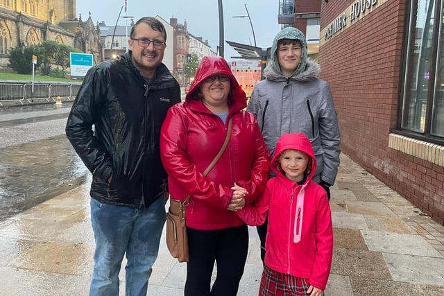 Pictured left to right: Chris King, Keeley Steele, Niamh King and Daniel Harrison.

Keeley: "It’ll just be fun, it’s something nice to do. What about you Niamh, we’ve come to see the fireworks haven’t we?"

Niamh: "Yes and watch my school!"

Keeley: "Her schools dancing on the bus station, so yeah it's a nice thing to do, and even in the rain, you’ve still got people coming out!"