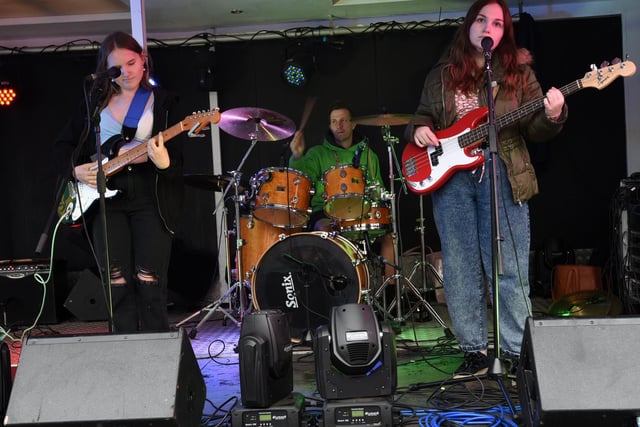 A band formed at Chorley Youth Zone perform on stage.