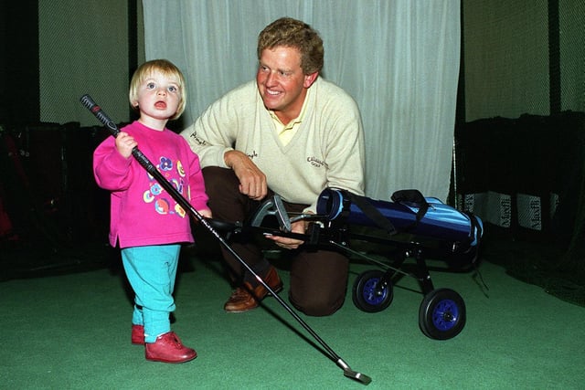 Colin Montgomerie visited Lillywhites in October 1996 to sign autographs and answer any question on golf. He is pictured with Hannah Goodall.