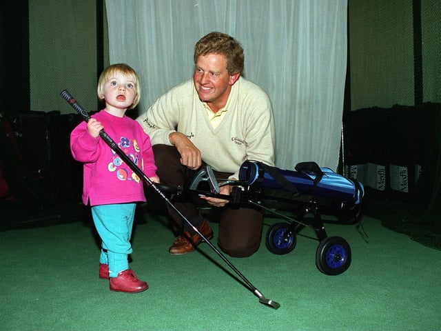 Colin Montgomerie visited Lillywhites in October 1996 to sign autographs and answer any question on golf. He is pictured with Hannah Goodall.
