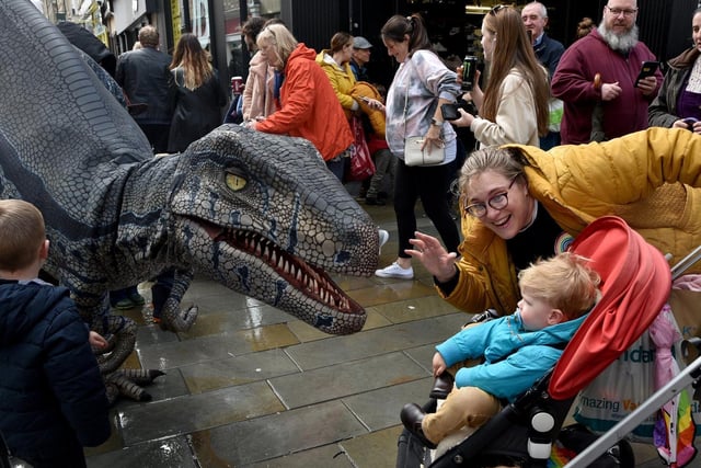 Shoppers meet Richie Raptor during the Dino Day in Lancaster City Centre. Photo: David Hurst
