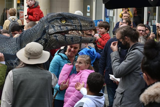 Richie Raptor meets shoppers during the Dino Day in Lancaster City Centre. Photo: David Hurst