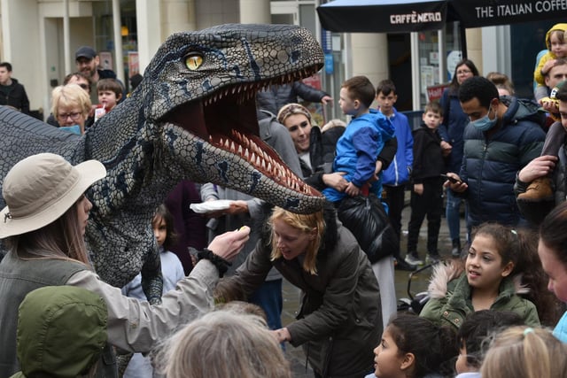 Dinsoaurs walk the streets during the Dino Day in Lancaster City Centre. Photo: David Hurst