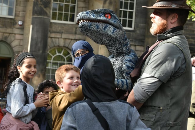 Youngsters meet the baby dinosaurs during the Dino Day in Lancaster City Centre. Photo: David Hurst