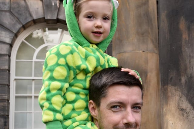 Zara Allen dressed as a dinsoaur during the Dino Day in Lancaster City Centre. She is pictured on her dad Michael's shoulders. Photo: David Hurst