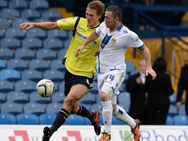 Ross McCormack challenges Birmingham City's Dan Burn.