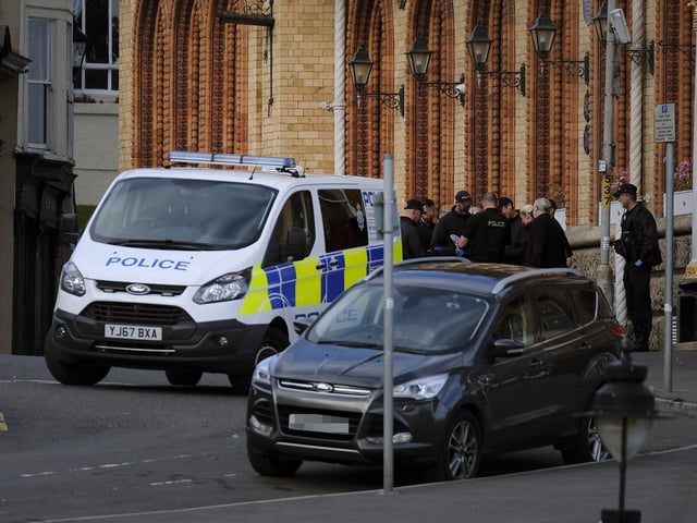 A group of officers ready to enter the building