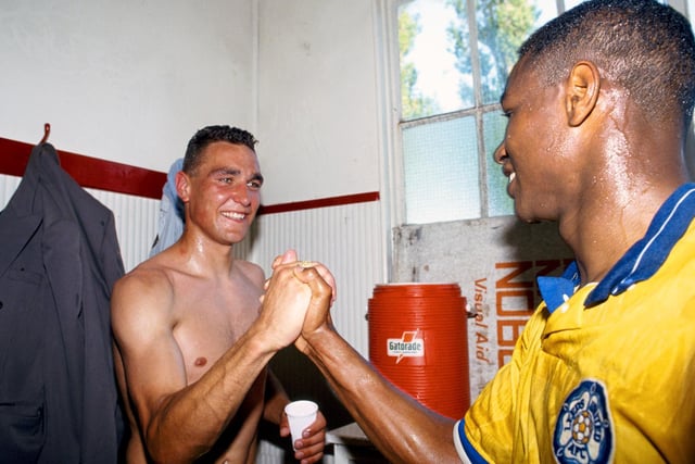 Vinnie Jones and Chris Fairclough celebrate after Leeds United had gained promotion to the First Division after a 1-0 win against Bournemouth at Dean Court in May 1990.