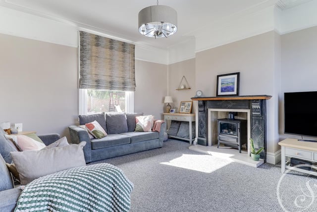 The large living room is ideal for sitting back and relaxing with family. It has a double glazed bay window to the front, double glazed window to the rear and a stunning feature fireplace with electric living flame fire.
