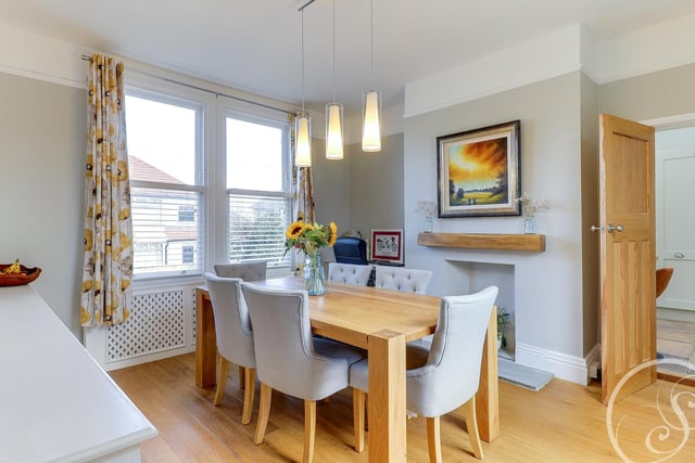 Across the hall is the formal dining room. The bright and airy space offers plenty of room for a large dining table, ideal for special mealtimes together.