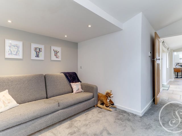 Through from the kitchen is a useful guest bedroom, which when not being used, could double up as a fantastic play area. It also benefits from an en-suite bathroom.