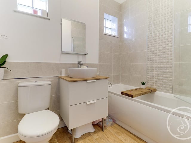 In total, there are three bathrooms in the property with one on each floor of the house.