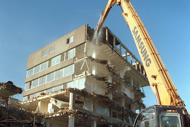 A specially-adapted excavator was used to progressively 'eat' its way down rienforced concrete whilst spraying water to stop dust in demolishing the old Leeds Fire Station on Kirkstall Road.