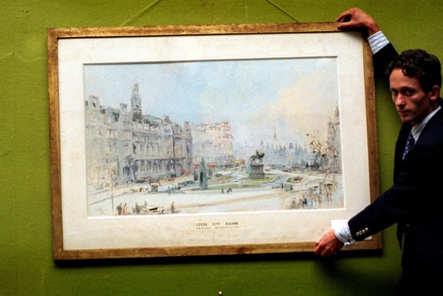 Assistant picture specialist Andre Zlattinger displays design proposals for Leeds City Square by painter John Atkinson Grimshaw at Phillips auctioneers in the city centre.