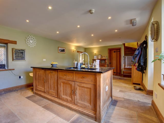 A freestanding island adds to the kitchen's facilities
