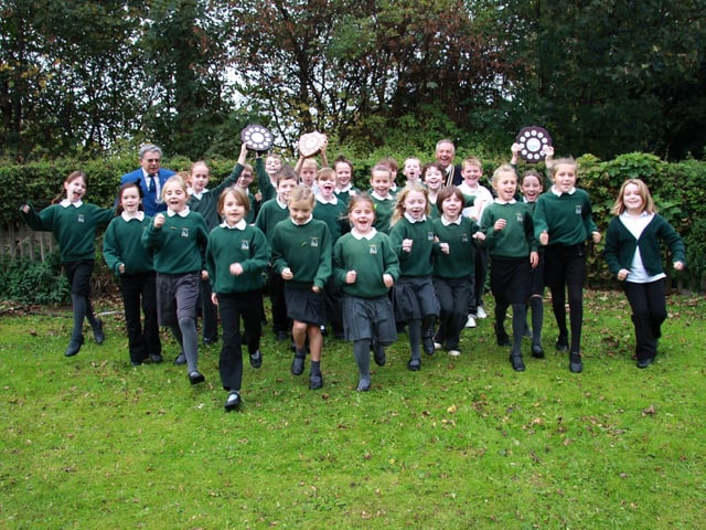 Children from Airy Hill School, winners of the Octoberfest, with Harry Collett and Rodney Nattriss.