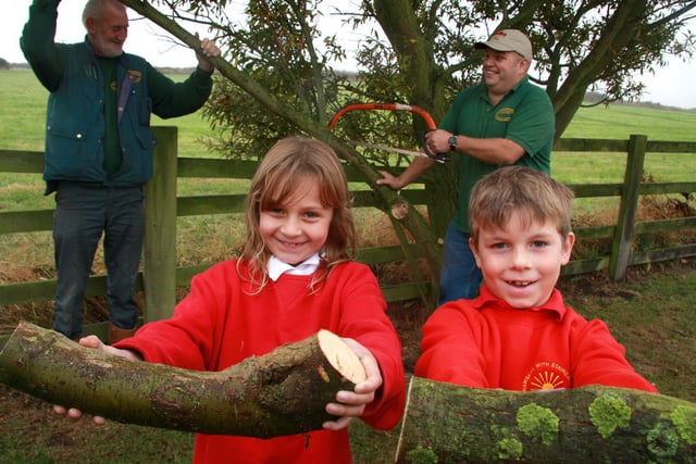 Hawsker School pupils Katie Ventress and Kieran Storr help to prune a willow tree.