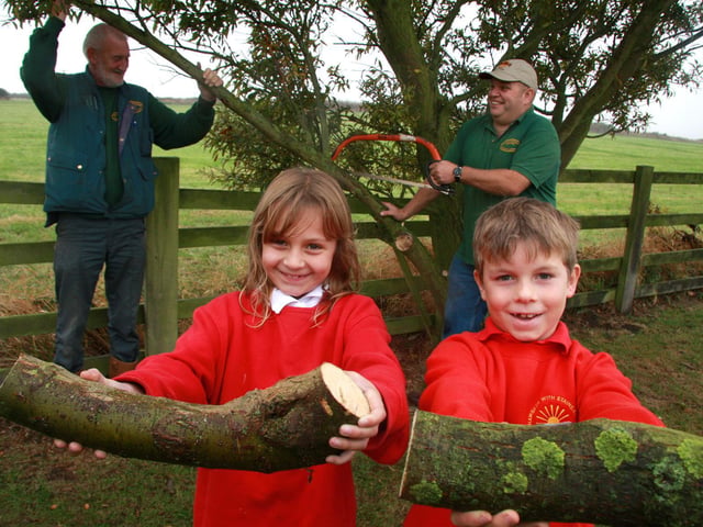 Hawsker School pupils Katie Ventress and Kieran Storr help to prune a willow tree.