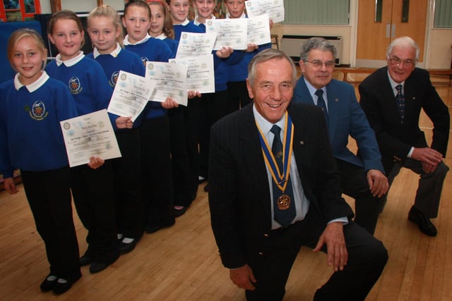 Children from Stakesby School are awarded their certificates for designing a new swing bridge.