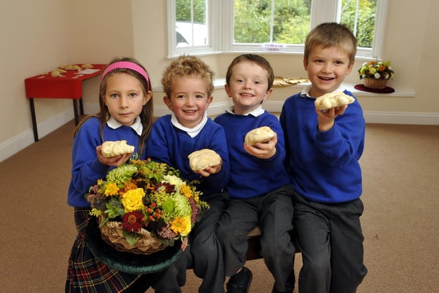 Pupils at St Hedda's RC School with bread they made for their harvest festival.