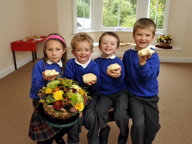 Pupils at St Hedda's RC School with bread they made for their harvest festival.