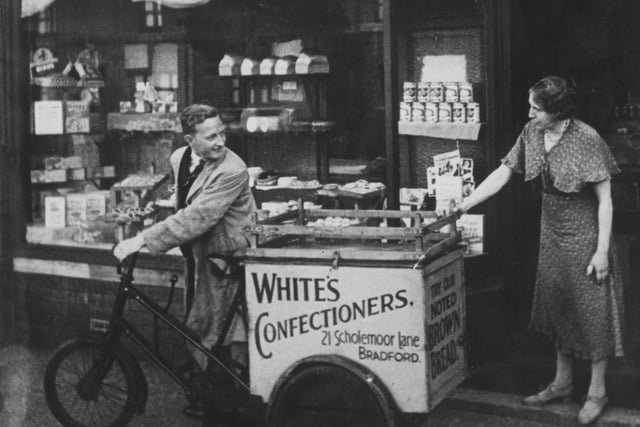 A deliveryman leaves White's confectioners shop on Scholemoor Lane, Bradford, in  1938.