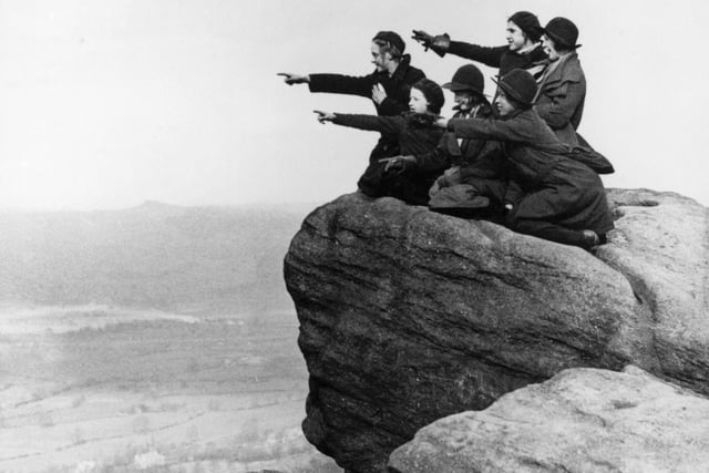 The Girl Guides of Bradford enjoy the view of Wharfedale from the rocks on Otley Chevin in April 1936.