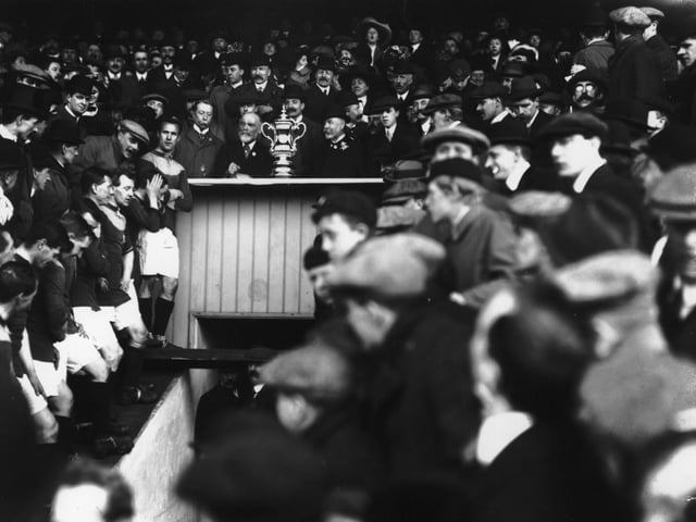 Bradford City players line up for the presentation of the FA Cup after their side's 1-0 victory over Newcastle United in the FA Cup final replay Old Trafford in April 1911.