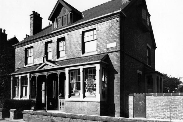 Kirkstall Avenue in September 1949. Pictured is M. Hitchen decorators and Dodgsons's grocery store.