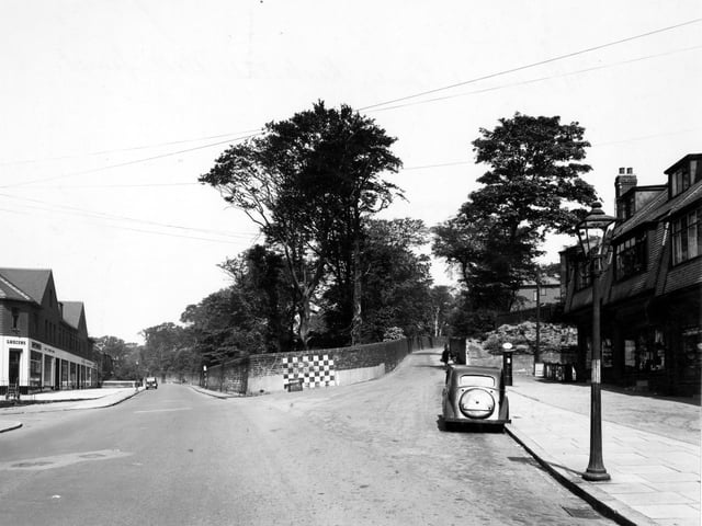 St. Ann's Lane and Kirkstall Hill in June 1949. Thrift grocers are on the left by the junction with Burley Wood Lane. On the right is a parade of shops.