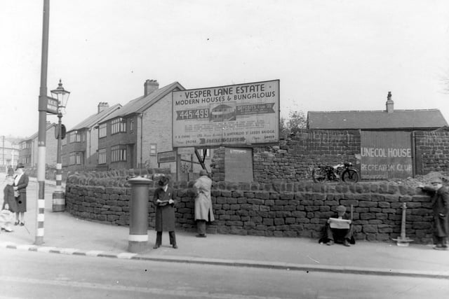 The corner of Vesper Gate Drive and Vesper Lane in May 1940 showing sign for new houses and bungalows built by F. R. Evans on the Vesper Lane estate at £455 - £499. Houses on Vesper Gate Drive are semi-detached. On Vesper Lane is the gate of Unecol House Recreation Club sports ground.