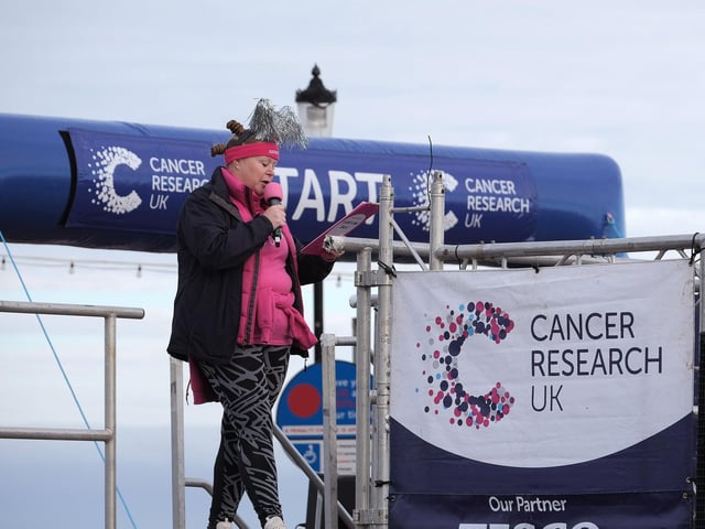 The compere gets the crowd going.