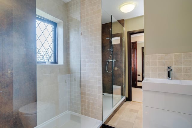 A tiled shower room within the property.
