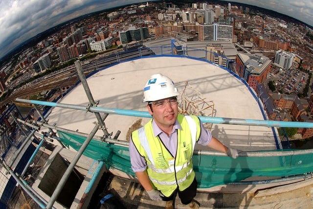 Graeme Atkinson, construction manager at the Bridgewater Place, the tallest building in Leeds, stands on the top floor of the building with a view of the city centre in the background in August 2006.