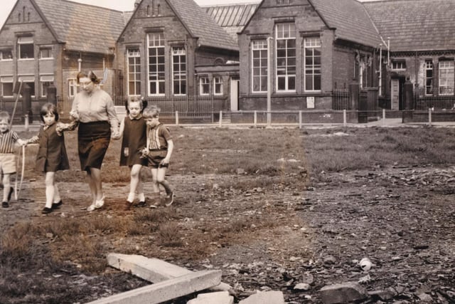 June Breisford, headteacher at Whinegate Road Primary, walks across the children's playground - opposite the school - with pupils, from left, Simon Allan, Sally Nelson, Carolyn Dawson and Philip Snelson in May 1970.