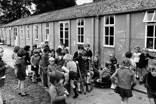 Another shivering winter faced pupils at  Deepdale Infants' School, a 30 year old "temporary built" school in Boston Spa, in October 1974. The parents' action group had drawn up a petition pressing for more urgent action from Leeds Education Committee and the Department of Education in finding a replacement for the flimsily built school.