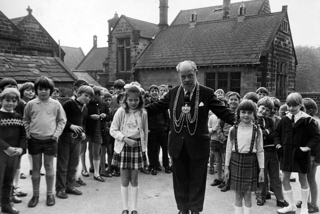 The Lord Mayor of Leeds, Alderman Albert Smith, paid a civic visit his former school - Meanwood Church of England Primary - in January 1972. He is pictured in the playground with Dawn Kinghorn (left) and Adele Poulter.
