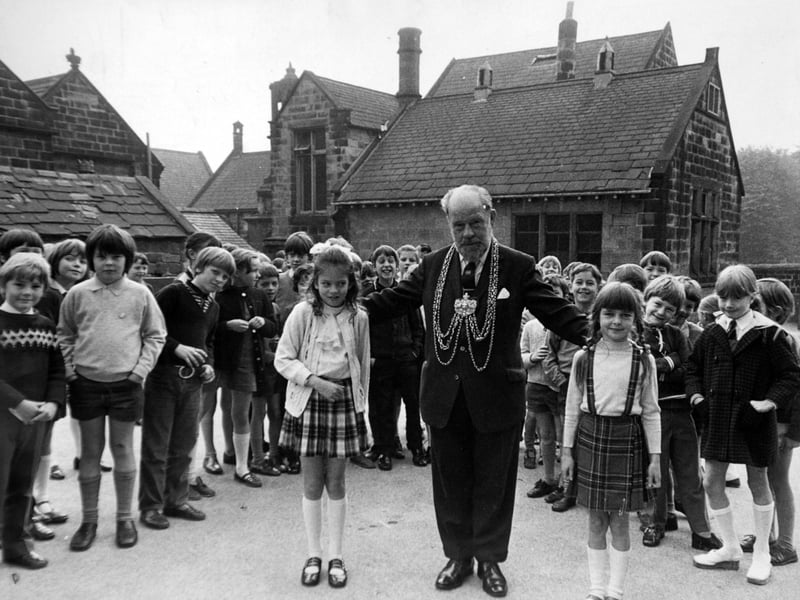 The Lord Mayor of Leeds, Alderman Albert Smith, visits his former school, Meanwood Church of England Primary, in January 1972. He is pictured in the playground with Dawn Kinghorn (left) and Adele Poulter.