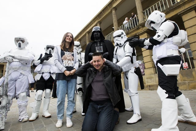 Phoebe Lonnergan, 14, and dad Dean Lonnergan with Sentinal Squad  Star Wars characters at The Piece Hall, Halifax.