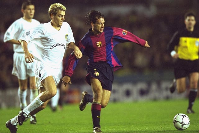 Barcelona's Alfonso holds off Jonathan Woodgate.