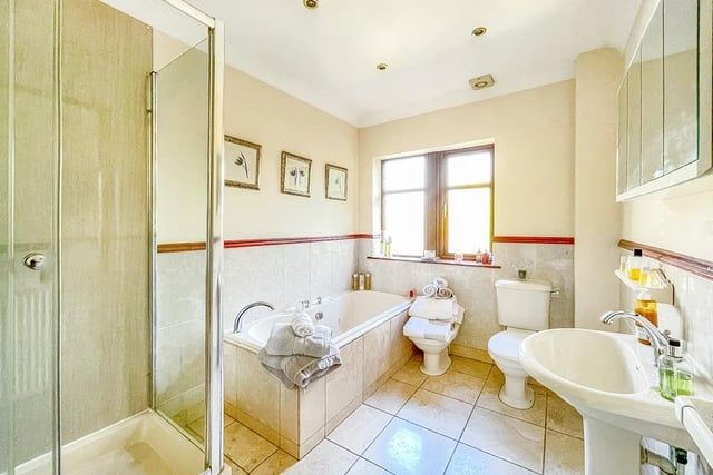 A half-tiled bathroom within the property.
